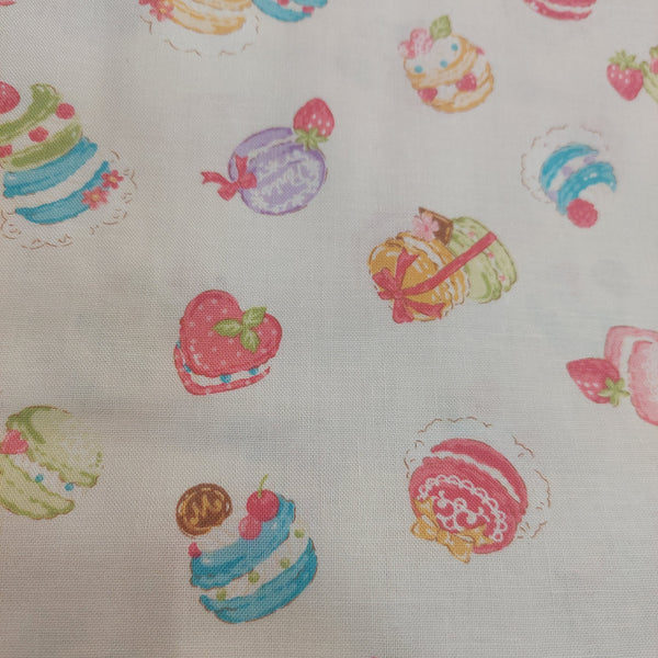 French Macrons cotton fabric by Cosmo AP35407-1A Ivory background